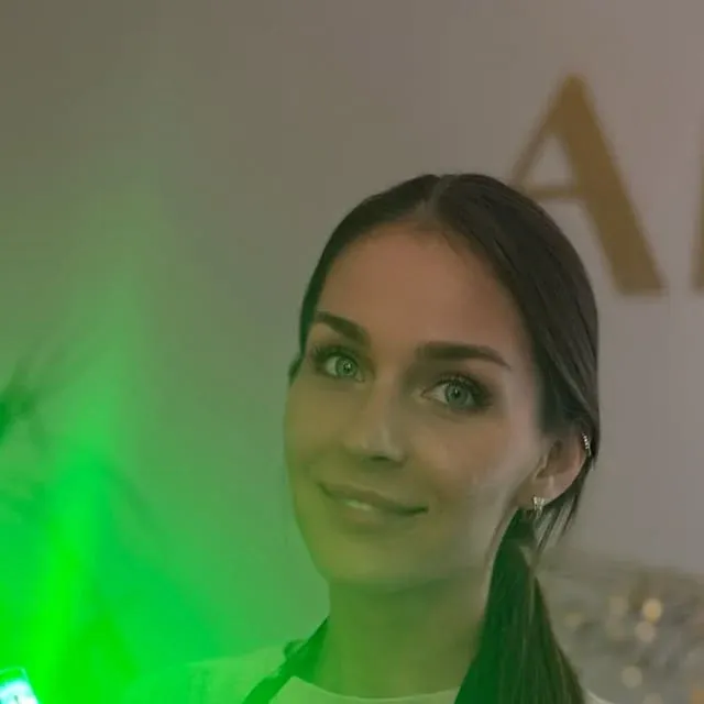 Viktoriia holding a hair treatment